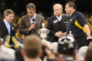 Allstate President Tom Wilson (far left) helps present Michigan coach Brady Hoke (far right) accepted the trophy for the Wolverines' victory in the 2012 Sugar Bowl. Allstate President Tom Wilson (far left) helps present Michigan coach Brady Hoke (far right) accepted the trophy for the Wolverines' victory in the 2012 Sugar Bowl.