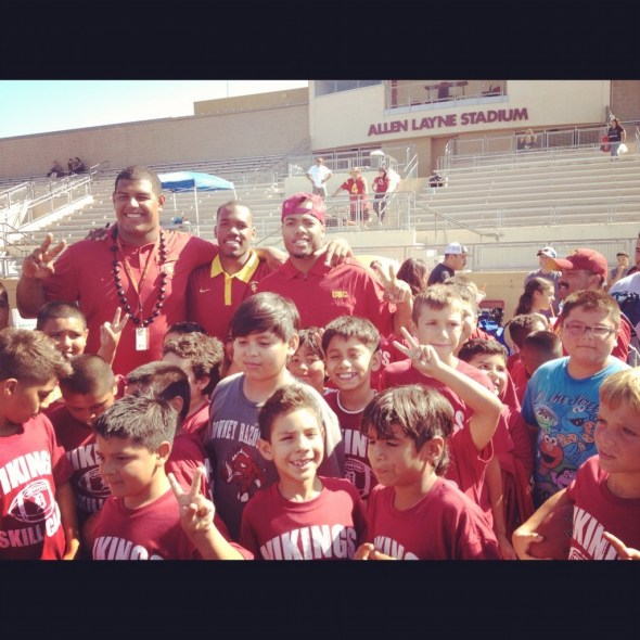 (Left to Right - Zach Banner, Jabari Ruffin, and TJ McDonald) USC Football players (Left to Right - Zach Banner, Jabari Ruffin, and TJ McDonald) visit a youth football camp at Downey high school. (Photo from TJ Mcdonald)